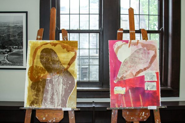 Two easels with canvas art in process